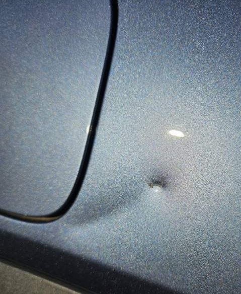 A deep dent beside a fuel flap