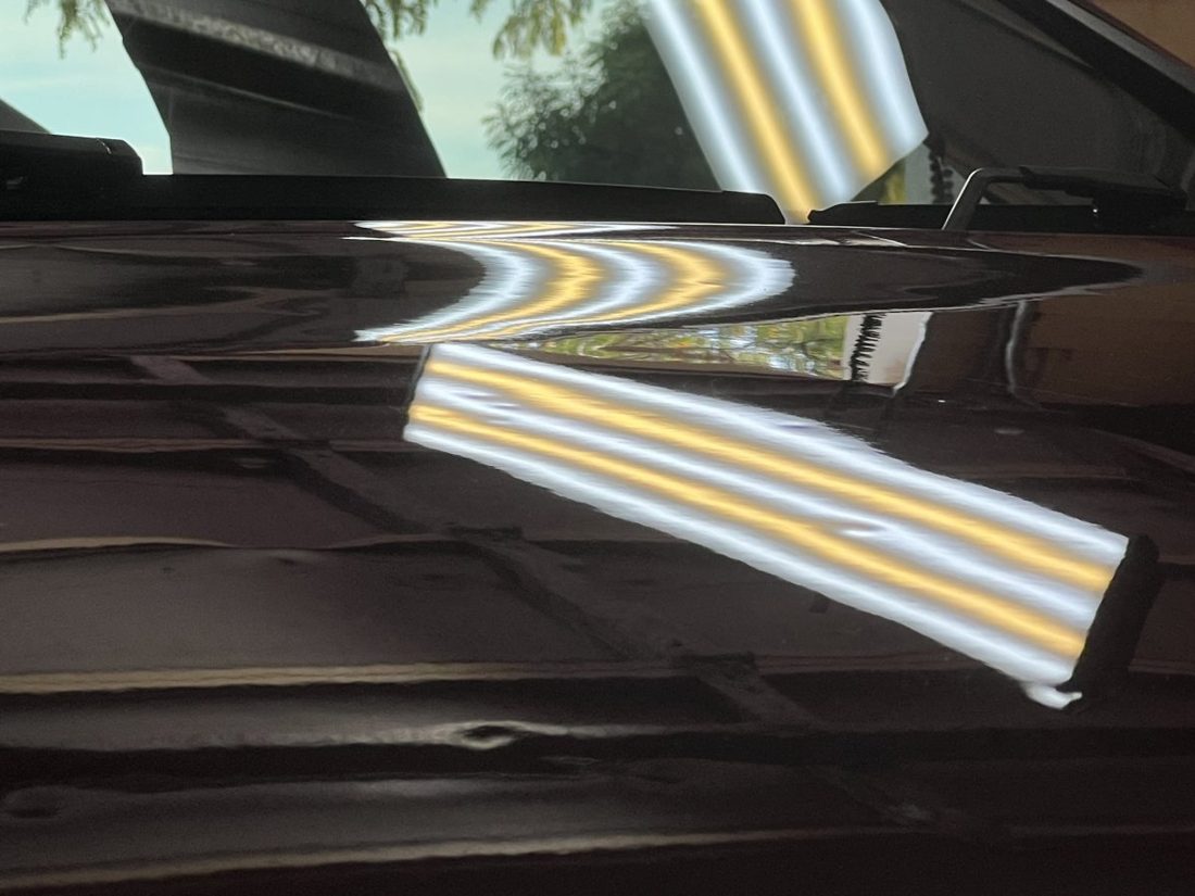 Bent lines on a door before the repair